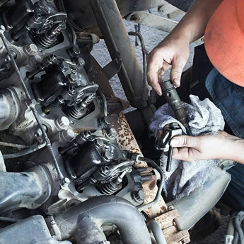 a mechanic working on an engine